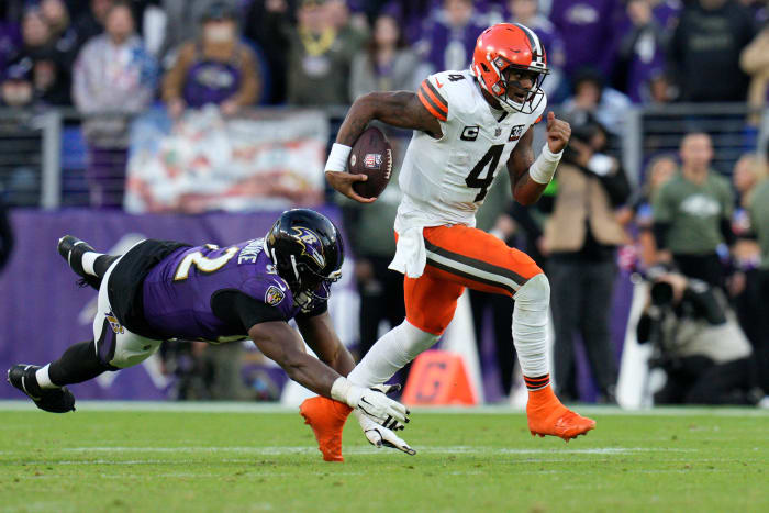 Cleveland Browns quarterback Deshaun Watson (4) runs with the ball as Baltimore Ravens defensive tackle Justin Madubuike (92) defends during the second half at M&T Bank Stadium.